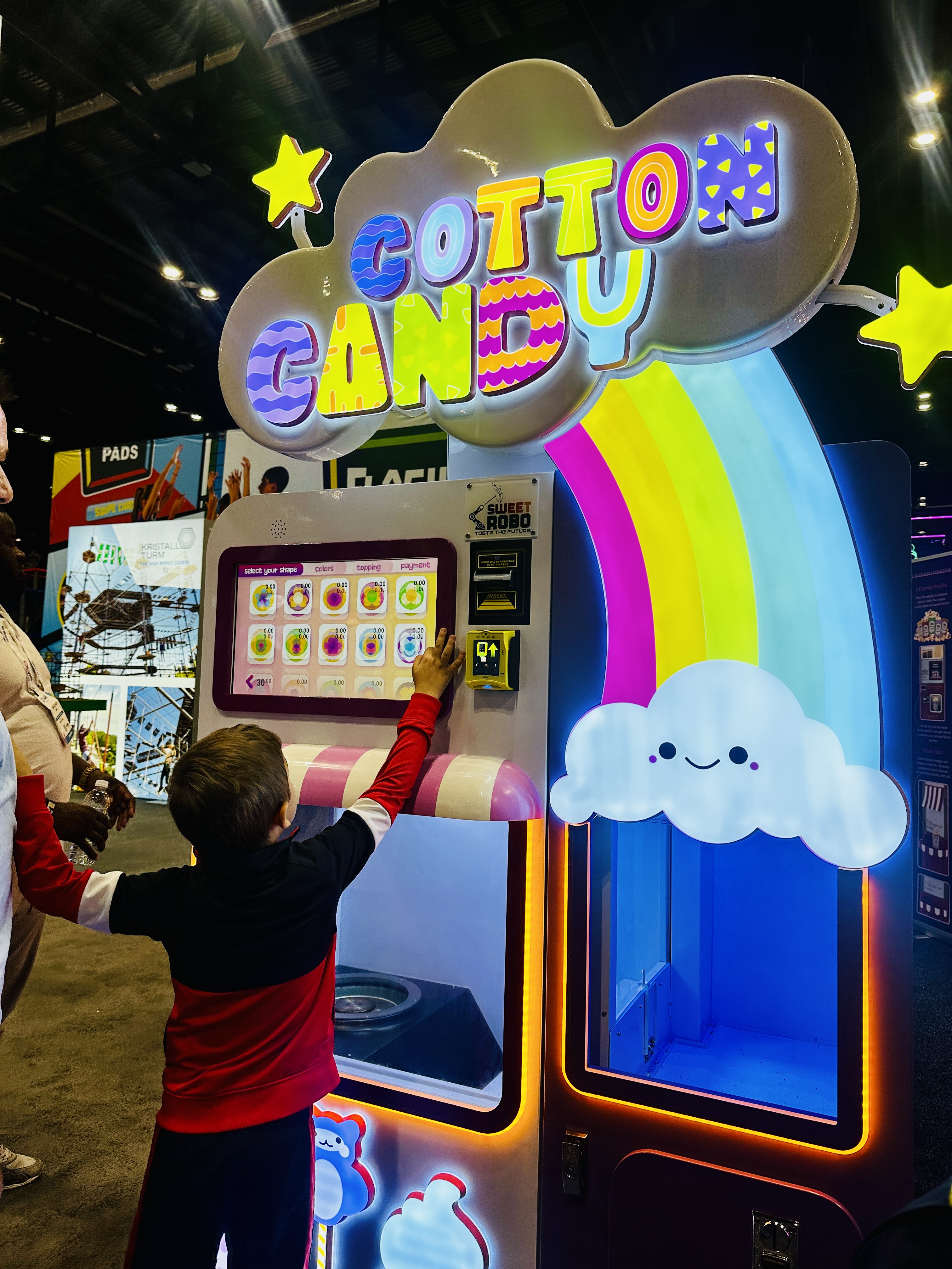 Child selecting cotton candy options